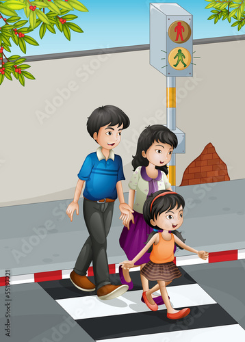 A family crossing the street