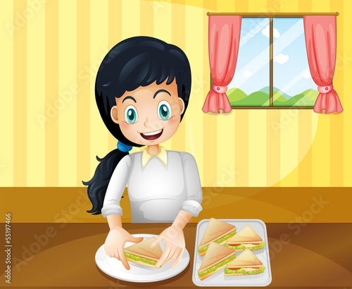 A happy woman preparing sandwiches