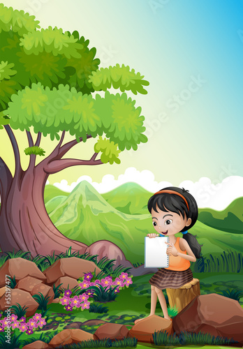 A girl doing her assignment outdoor