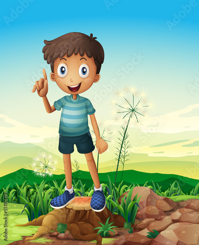 A stump with a young man standing