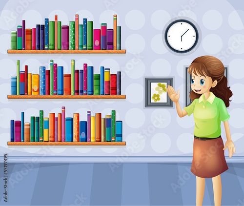 A female librarian inside the library