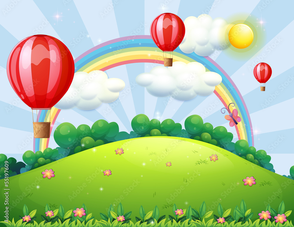 Fototapeta premium Floating balloons at the hilltop with a rainbow