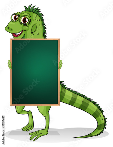 A greenboard with an iguana at the back