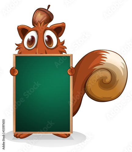 A squirrel hiding at the back of an empty blackboard