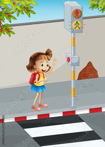 A happy young girl with a backpack