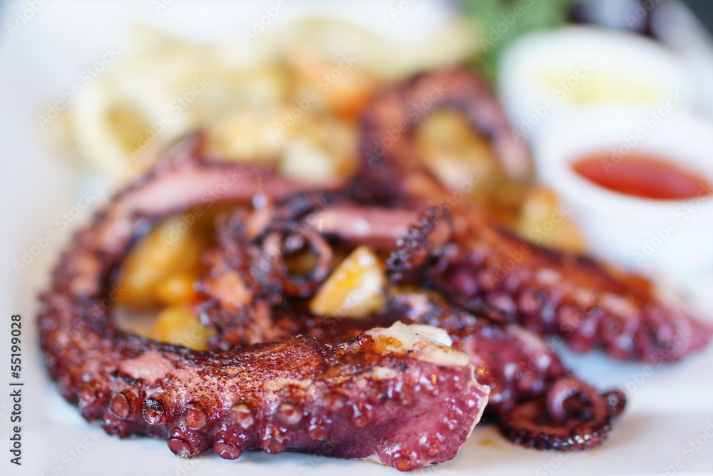 Sea food: grilled octopus served on a plate Sea food: grilled octopus served on a plate