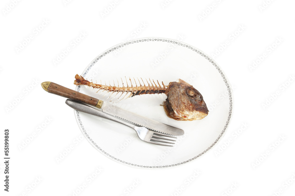 Fototapeta premium Fish skeleton on the plate - symbol for food shortage