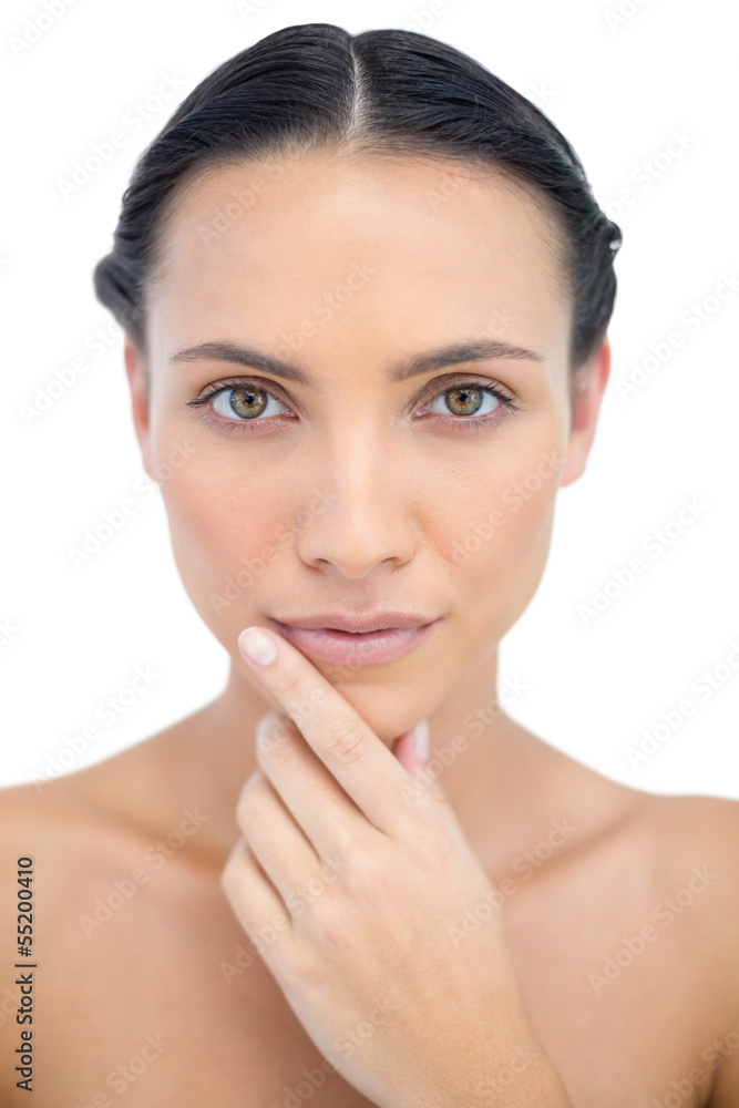 Pensive sensual model posing while touching her chin Pensive sensual model posing while touching her chin