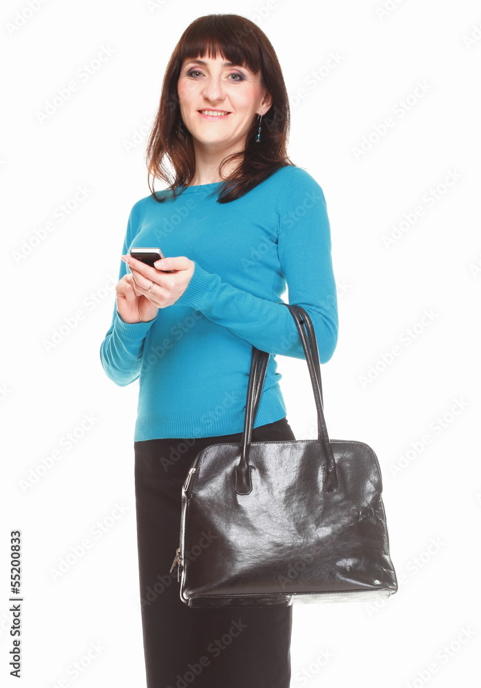 Woman typing on mobile phone and holding a bag Woman typing on mobile phone and holding a bag