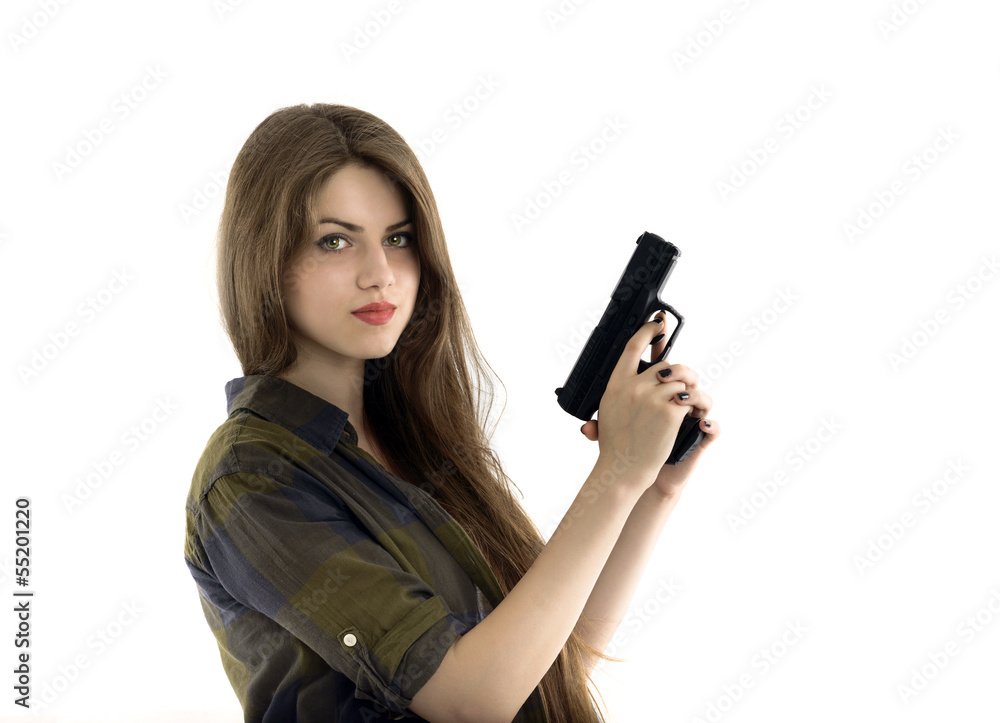 Young beautiful woman holding a gun on white background Young beautiful woman holding a gun on white background