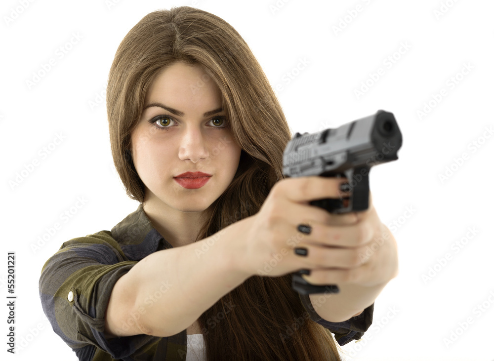 Young beautiful woman holding a gun on white background Young beautiful woman holding a gun on white background