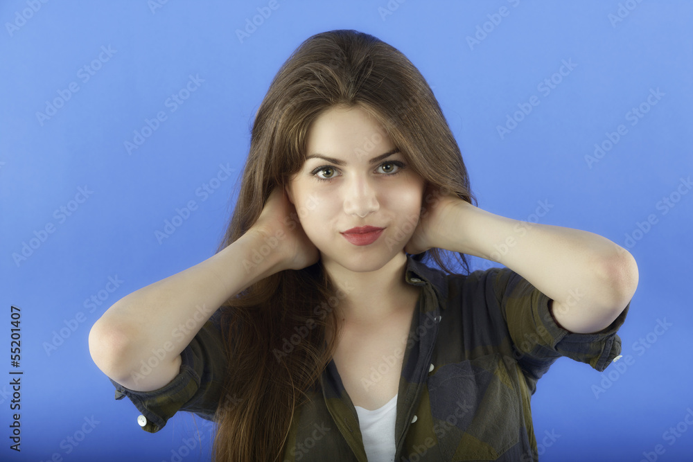 studio portrait of beautiful woman with long hair on blue backgr studio portrait of beautiful woman with long hair on blue backgr