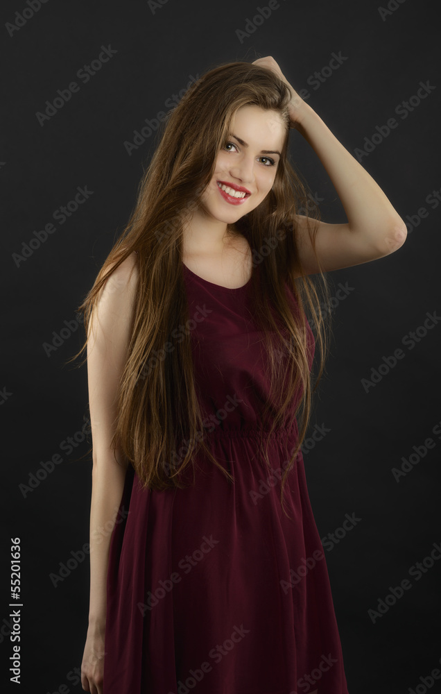 Fototapeta premium long hair young woman with dark makeup, studio black background