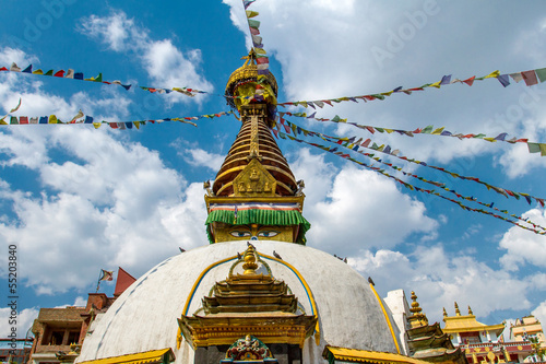 Kathesimbu Stupa with Buddha wisdom eyes and prayer colorful fla