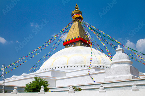 Buddhist shrine Boudhanath Stupa with Buddha wisdom eyes and pra