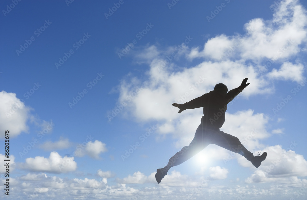 Silhouette of Man Jumping Over Sun. Silhouette of Man Jumping Over Sun.