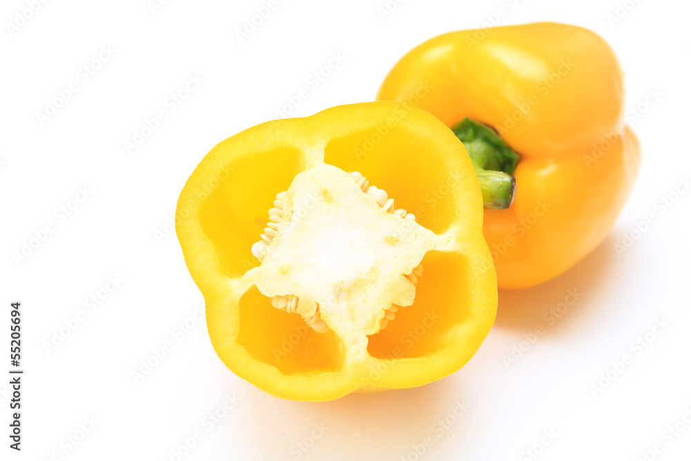 Organic yellow  peppers on a white background