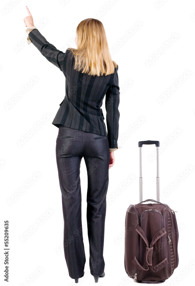 Back view of traveling business woman with suitcase. Back view of traveling business woman with suitcase.