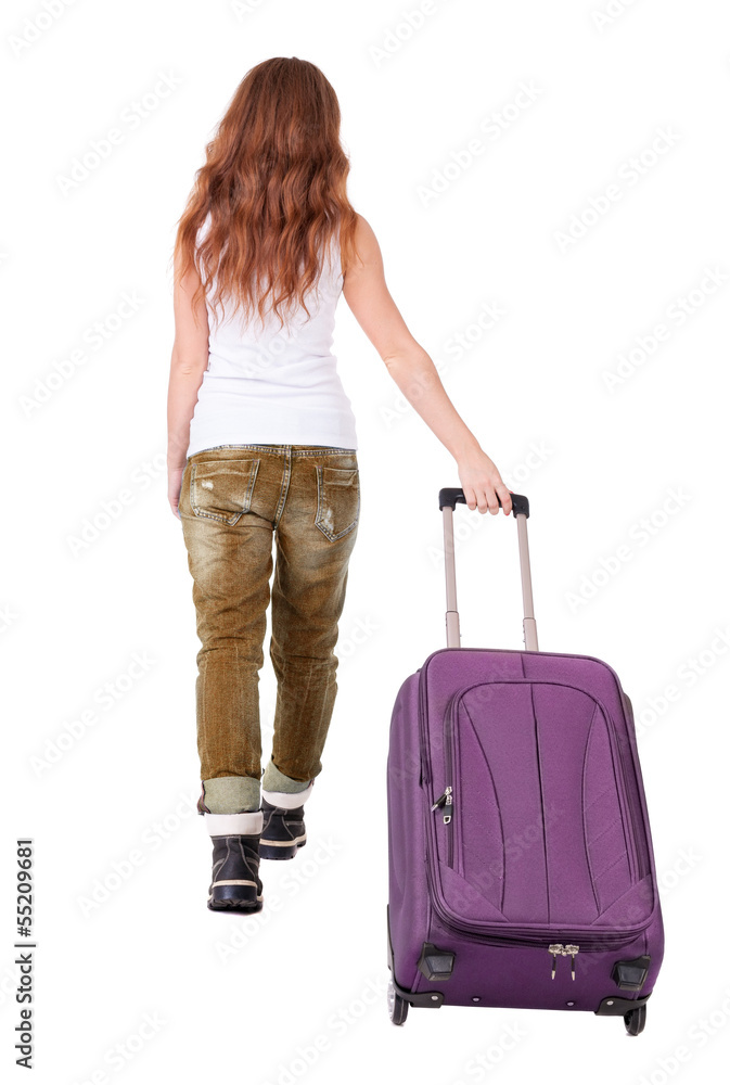 back view of walking woman with suitcase back view of walking woman with suitcase