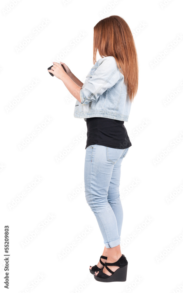 Back view of woman photographing. Back view of woman photographing.