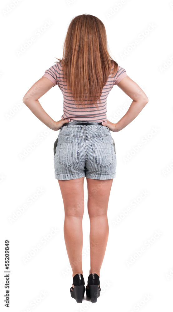 back view of standing young beautiful redhead woman back view of standing young beautiful redhead woman