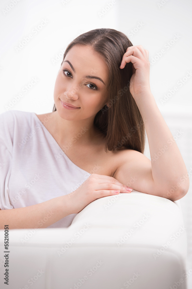 Beautiful young women. Beautiful young women sitting on the couc Beautiful young women. Beautiful young women sitting on the couc