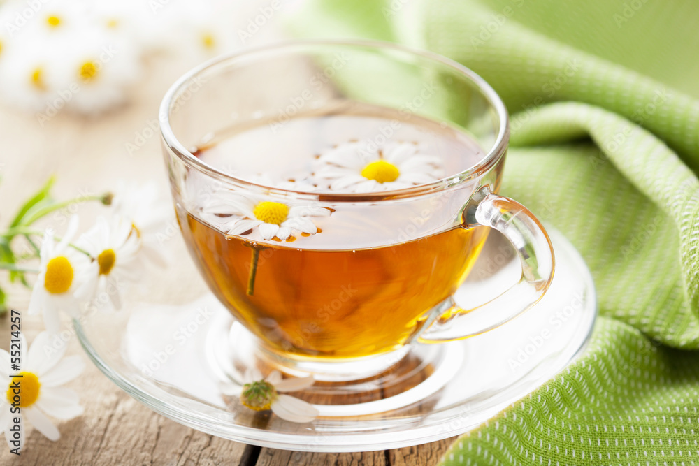 cup of herbal tea with chamomile flowers cup of herbal tea with chamomile flowers