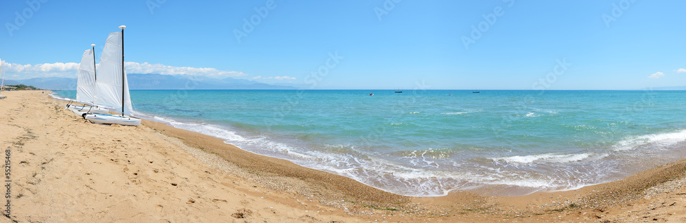 Panorama of sail yachts on the beach on Ionian Sea at luxury hot