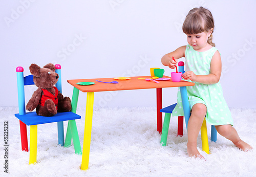 Little cute girl sitting