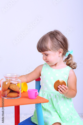 Little cute girl sitting