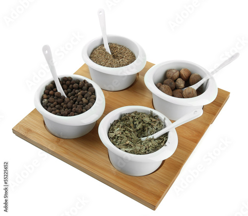 Assortment of spices in  white  bowls 