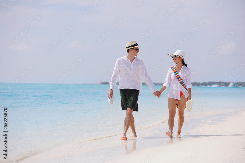happy young couple have fun on beach happy young couple have fun on beach