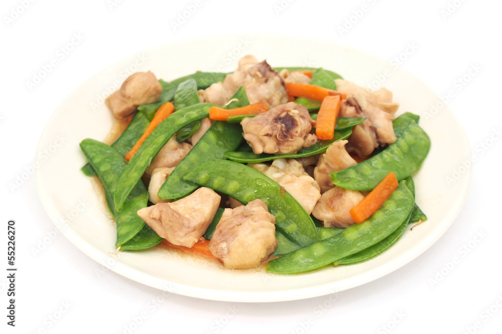 Stir fried snow peas and chicken on plate Stir fried snow peas and chicken on plate
