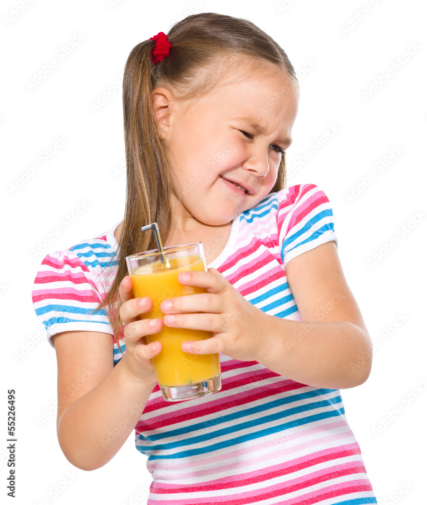 Little girl unwillingly drinking orange juice Little girl unwillingly drinking orange juice