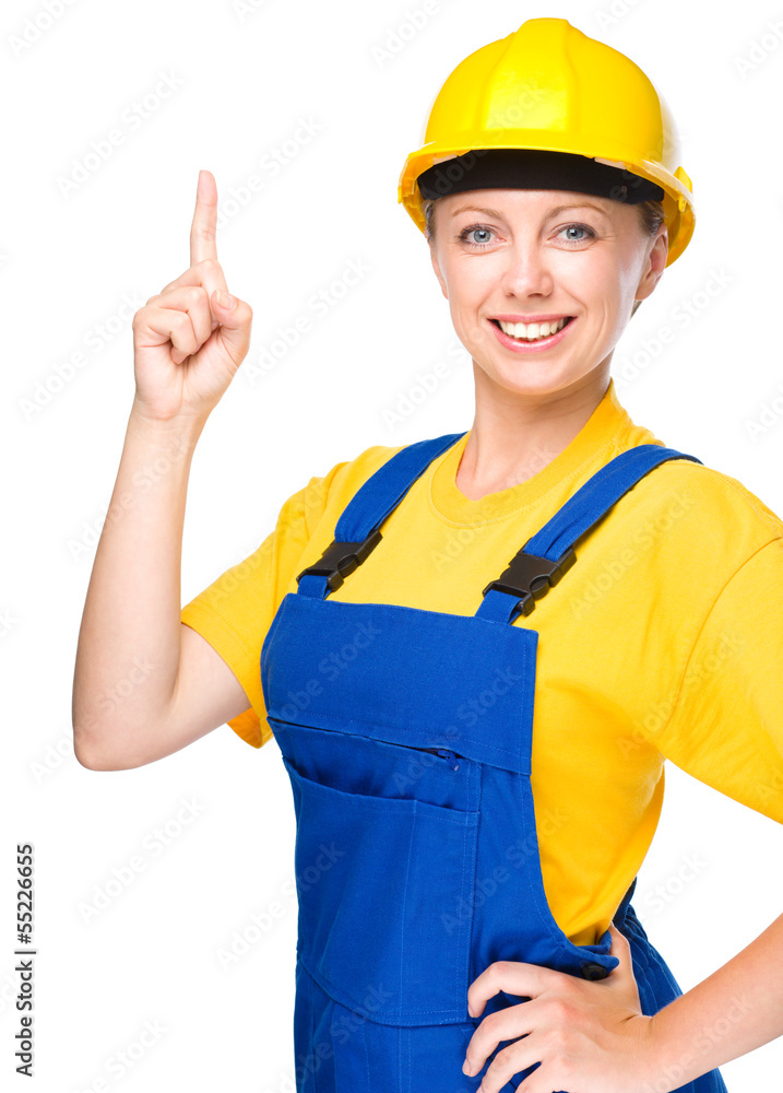 Young construction worker pointing up Young construction worker pointing up