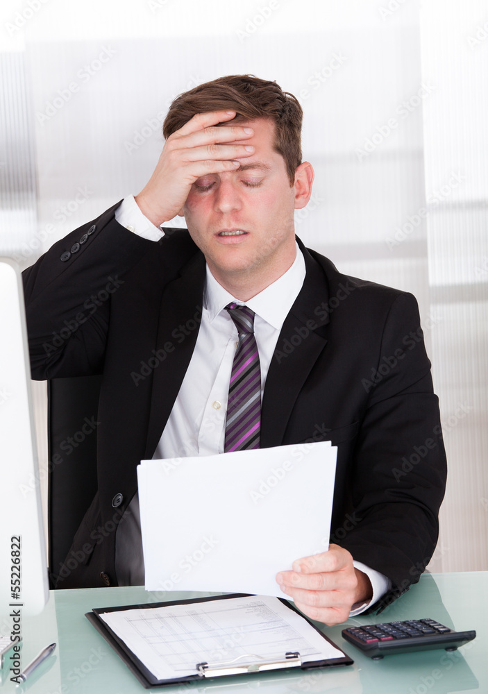 Anxiety businessman sitting in office Anxiety businessman sitting in office