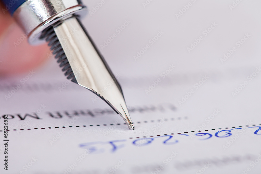 Fototapeta premium Businessman Writing With Ink Pen