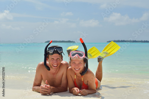 happy young couple have fun on beach