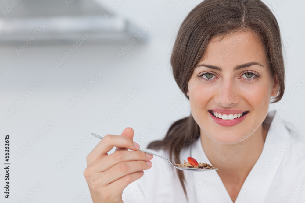 Woman having breakfast of cereal