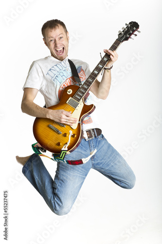 Man is rocking on electric guitar