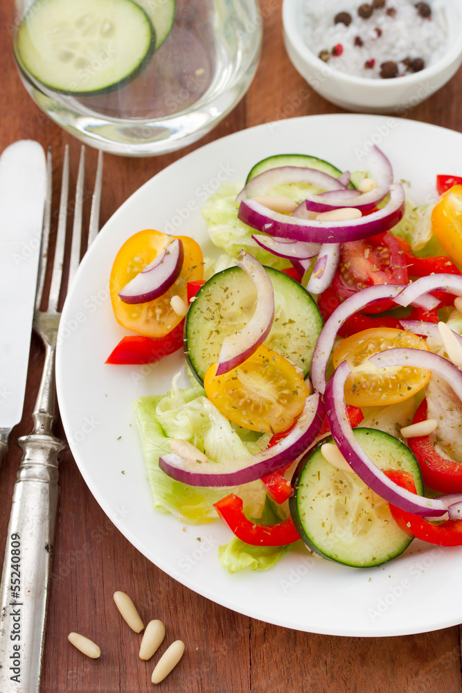 vegetable salad with nuts on plate vegetable salad with nuts on plate
