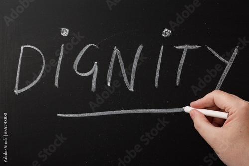 Canvas-taulu Writing the word Dignity on a blackboard