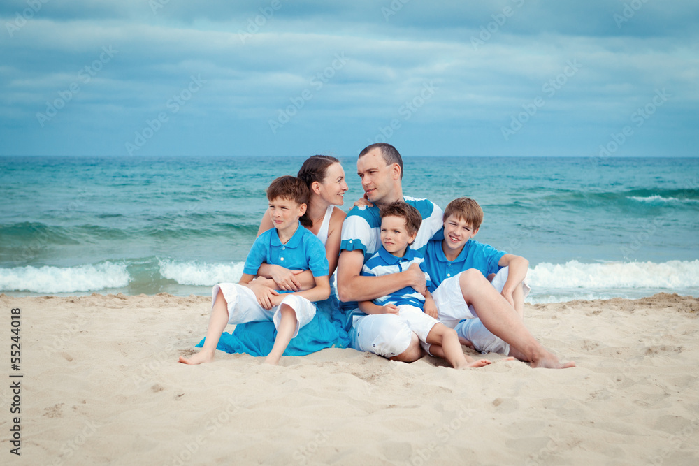 Young family with three kids on vacation