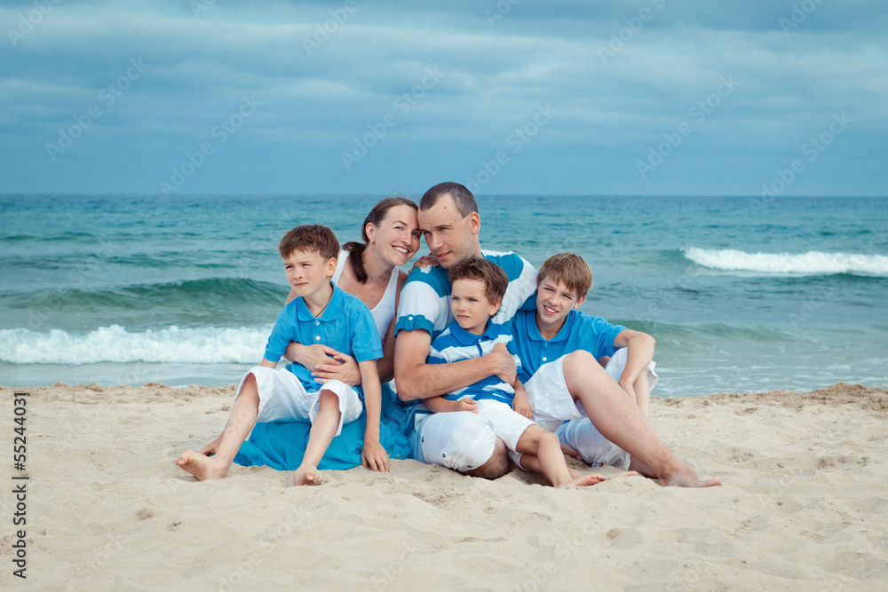 Young family with three kids on vacation