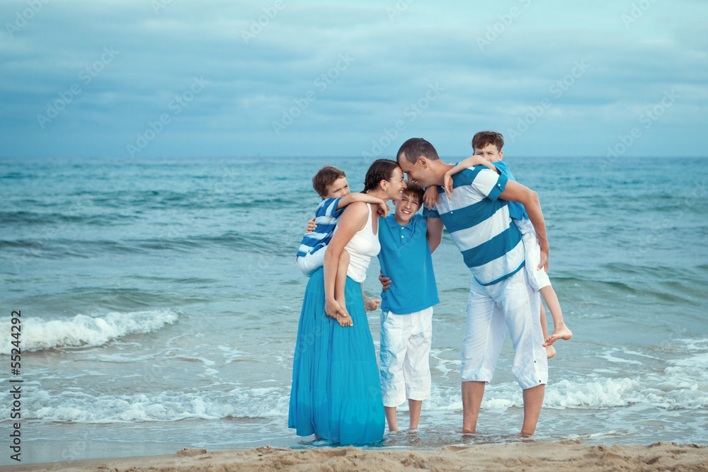 Young family with three kids on vacation