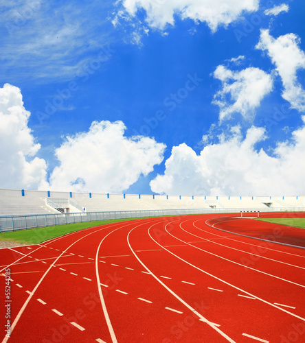 Running track with lanes over sky and clouds