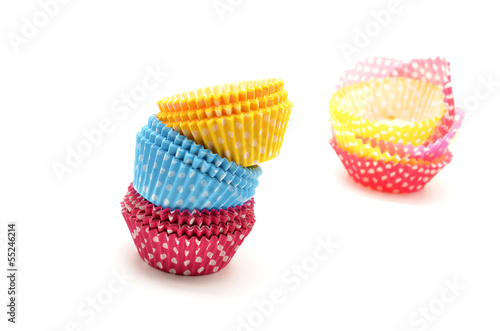 Stack of colorful cupcake cases © neftali