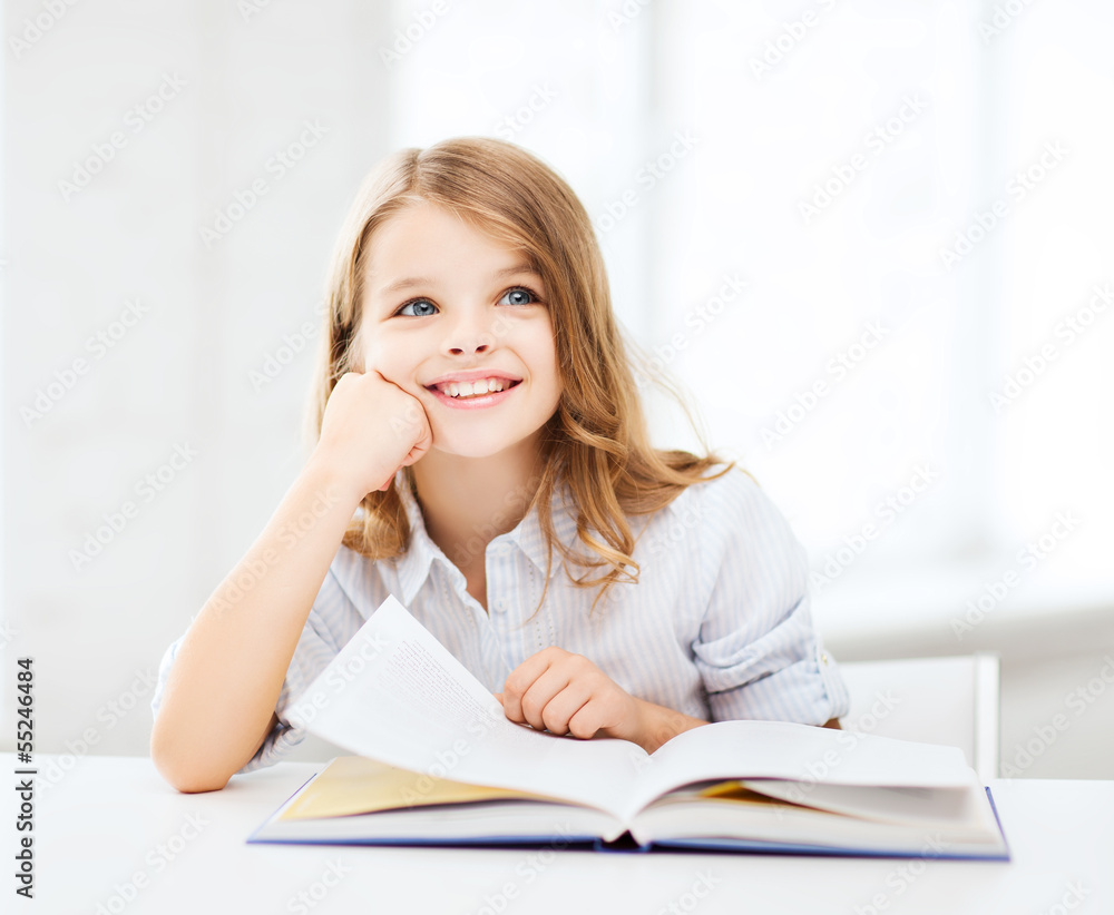 little student girl studying at school little student girl studying at school