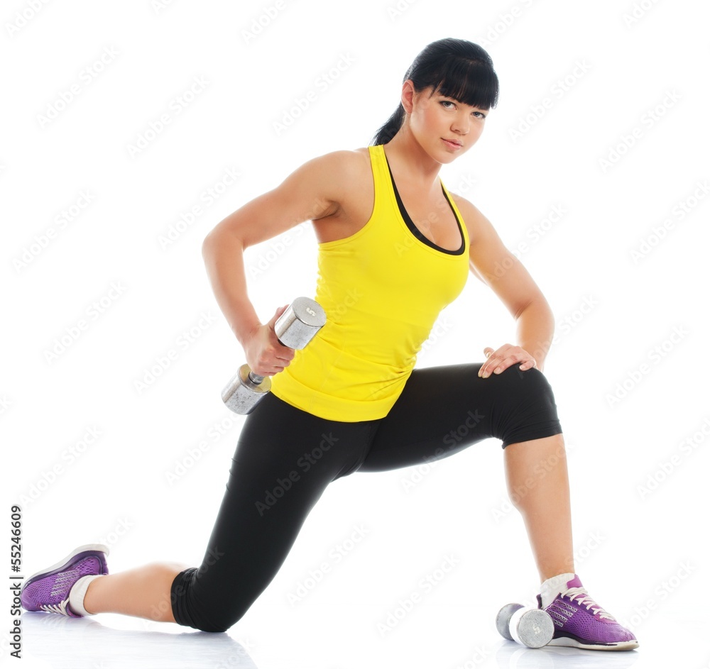 Beautiful girl doing fitness exercise with dumbbells Beautiful girl doing fitness exercise with dumbbells