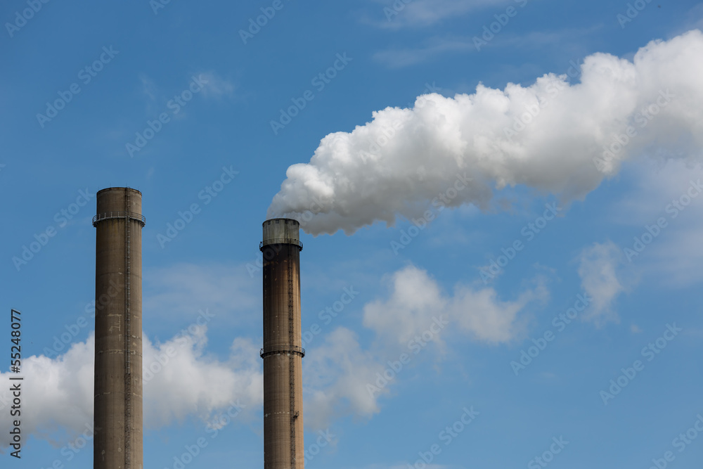 Industrial smoke stacks of a power plant. Industrial smoke stacks of a power plant.